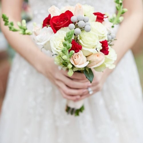 bride holding bouquet stone manor